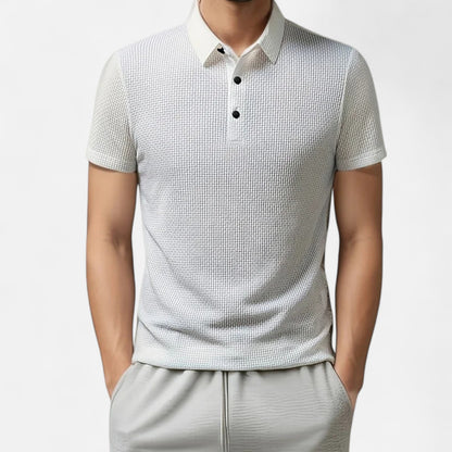 Velour Mode | Polo Femme Manches Courtes à Motif Floral Osseux – Élégance Sportive Monochrome